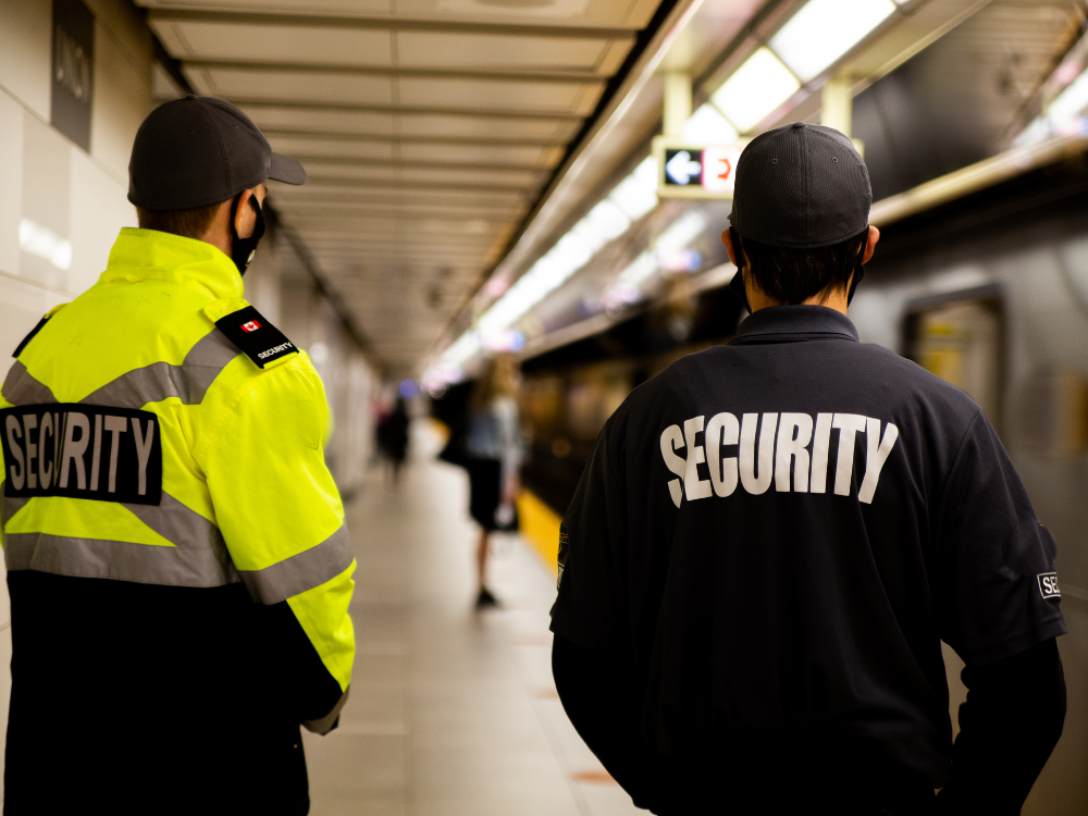 Armed security guard standing outside on patrol