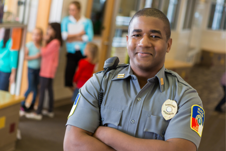 School security guard standing in a hallway